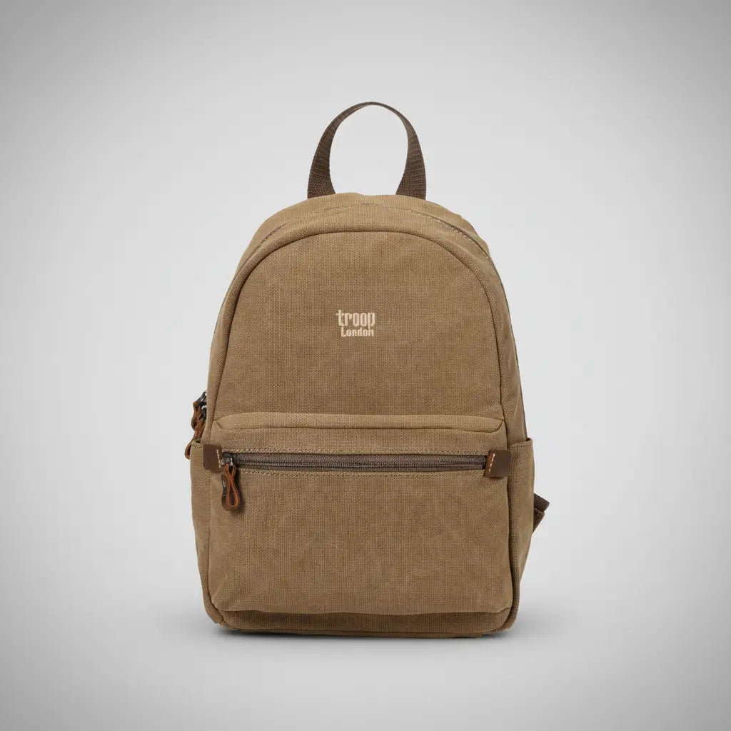Stone-washed canvas meets aged leather in a backpack designed for life in motion. Compact, considered, and built to last.