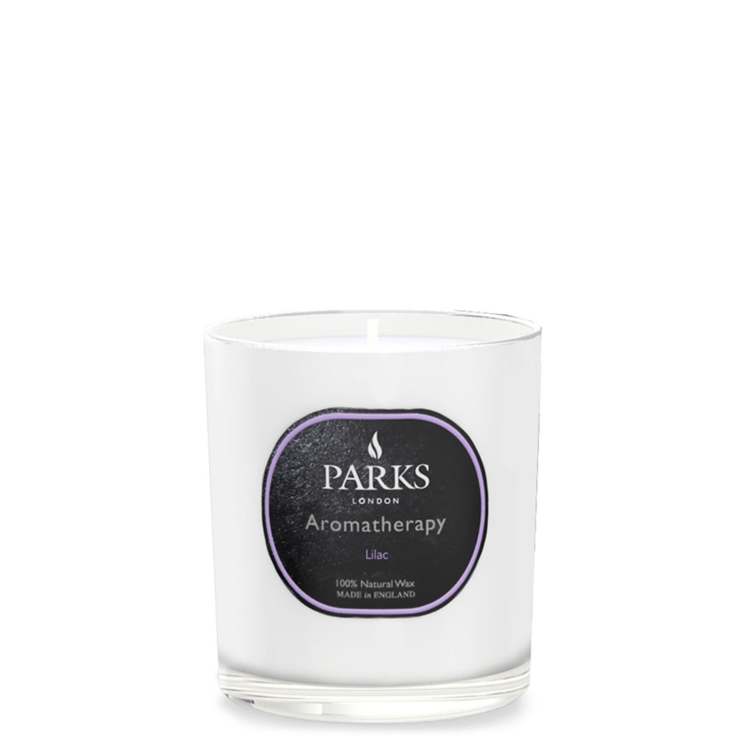 Parks Candles lilac scented candle in a 220g glass jar, with a soft purple hue and a lit wick for cozy ambiance.