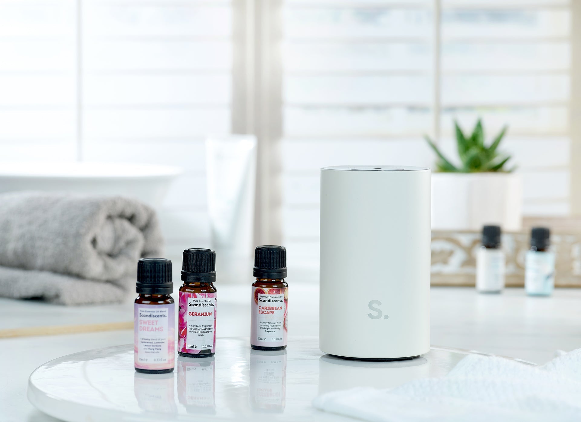 Scandiscents Halo Home Diffuser displaying a sleek waterless scented oil diffuser with modern design and branding.