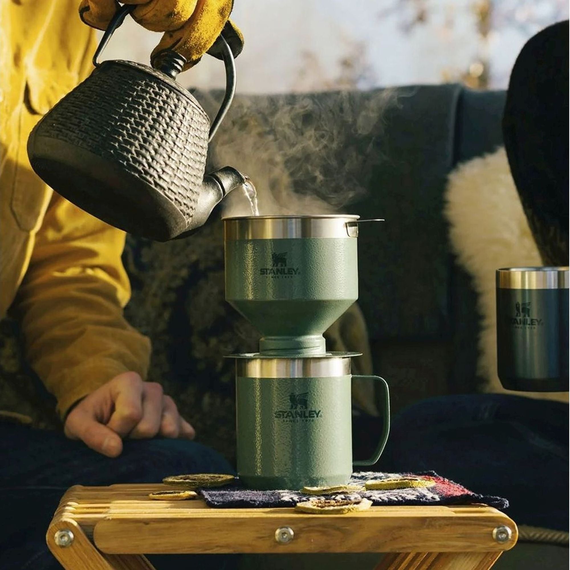 Stanley Stay Hot Camp Mug 0.35L travel mug with stainless steel body and black handle, designed for hot beverages on the go.