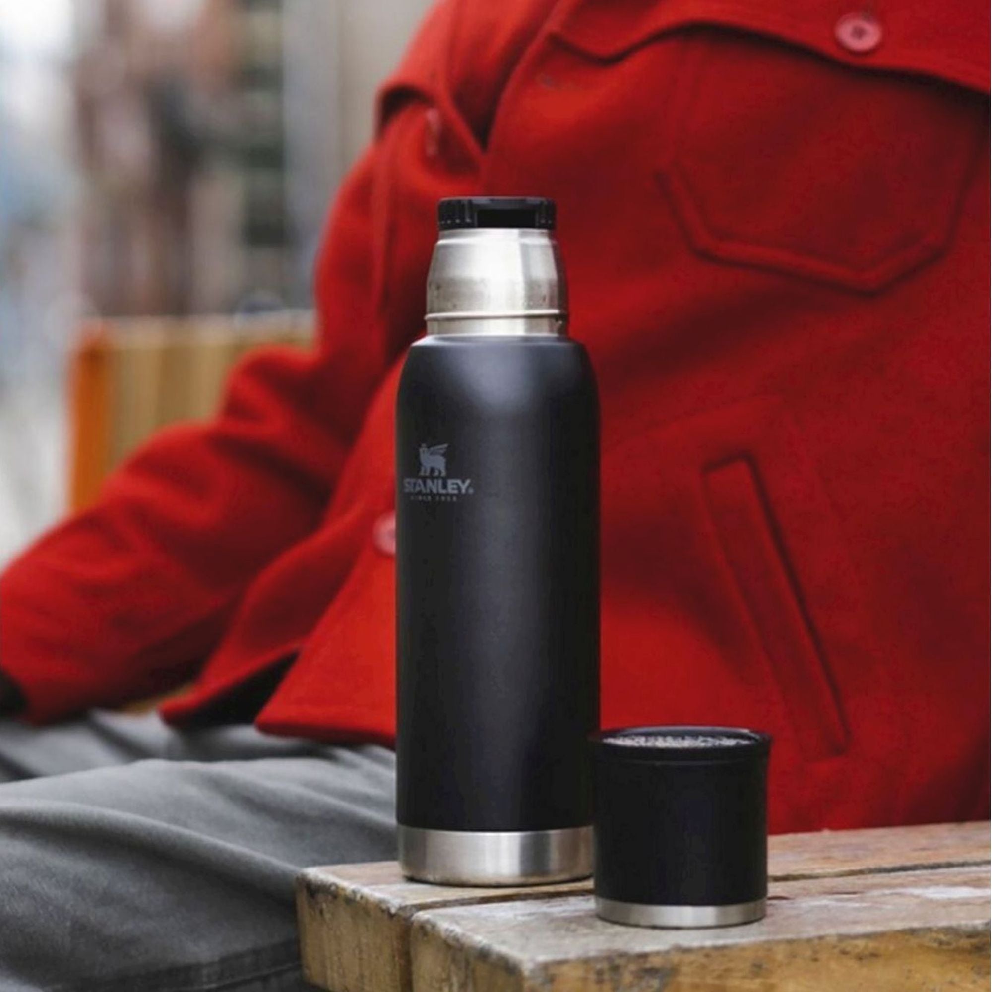 Stanley Adventure To Go 1.0L water bottle with stainless steel body and screw-on lid, ideal for outdoor hydration.