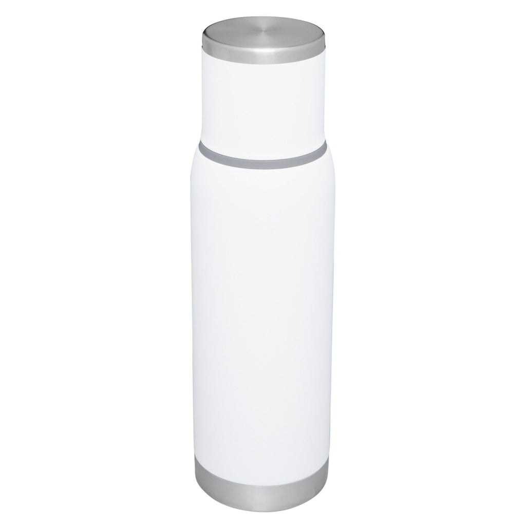 Stanley Adventure To Go 1.0L water bottle in stainless steel with a black lid and carrying handle, outdoor-ready hydration container