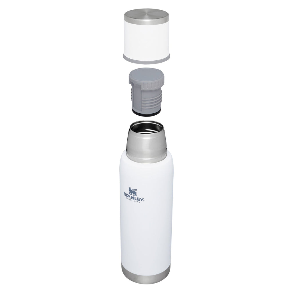 Stanley Adventure To Go 1.0L water bottle in stainless steel with a black screw cap and carrying handle on a white background.