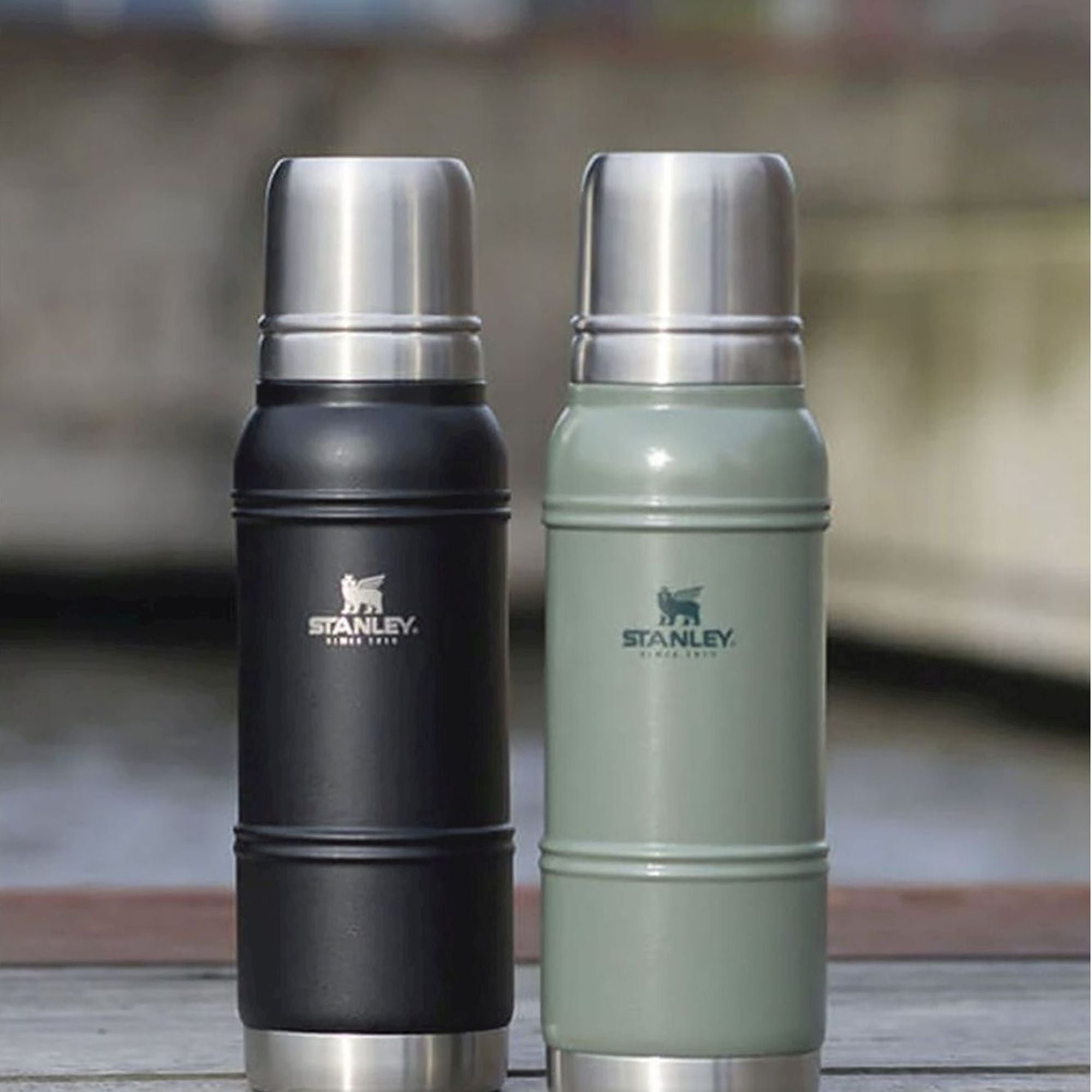 Stanley Artisan Thermal Bottle 1.0L water bottle in stainless steel with a black cap, designed for keeping drinks hot or cold.