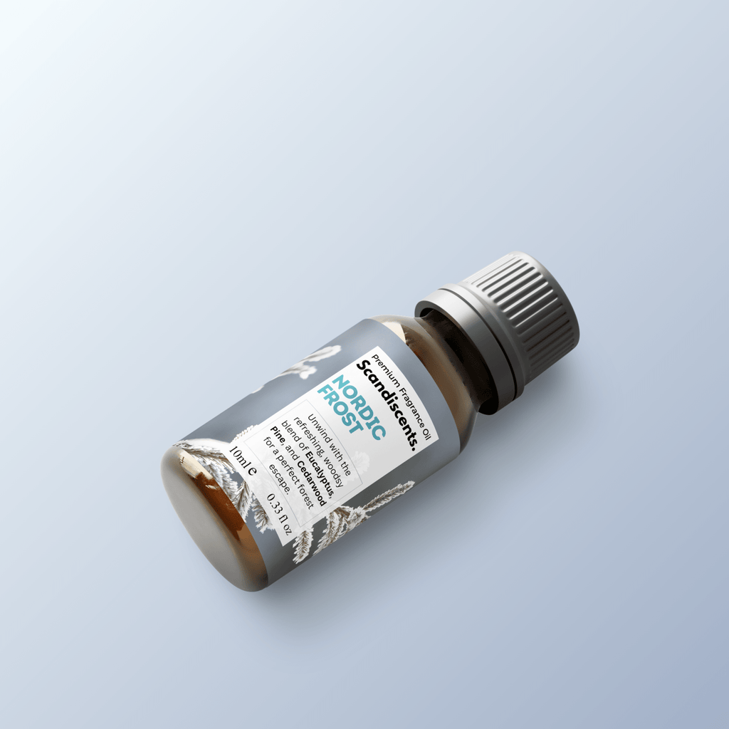 Nordic Frost fragrance oil by Scandiscents in a glass bottle with a silver cap, showcasing a cool, wintery scent.