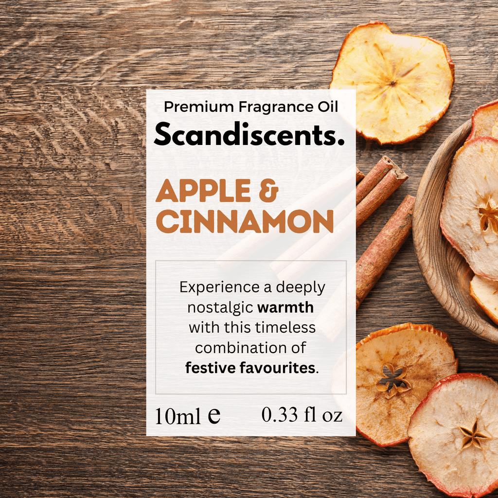 Scandiscents Apple & Cinnamon fragrance oil bottle with orange and cinnamon stick accents on a white background.