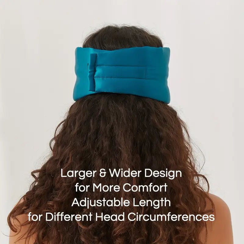 Black silk sleep mask by DREAMSILK, featuring a smooth, luxurious design for blocking out light and enhancing sleep comfort.