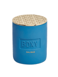 BDXY Studios scented candle in a glass jar, featuring a warm, inviting aroma and a natural wax finish.