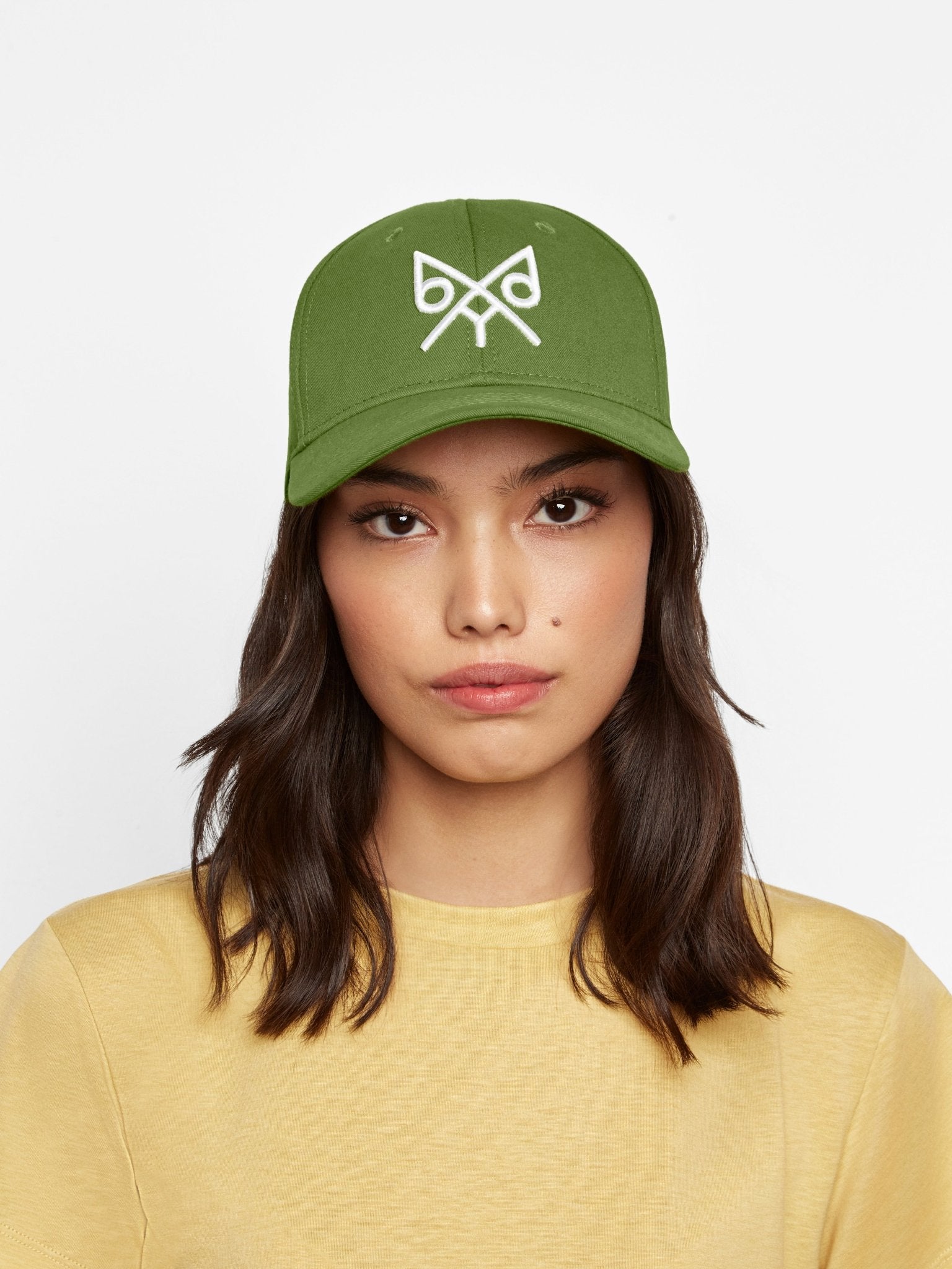 Oregon Green "The Focus" baseball cap by BDXY Studios, showing front view with adjustable strap and curved brim.
