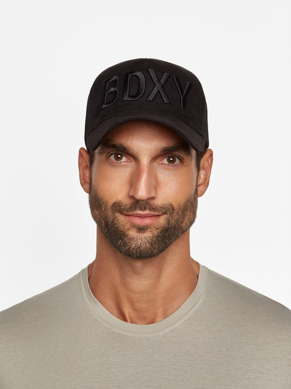 Black "The Gaffer" Trucker Cap by BDXY Studios featuring a mesh back and branded front embroidery.