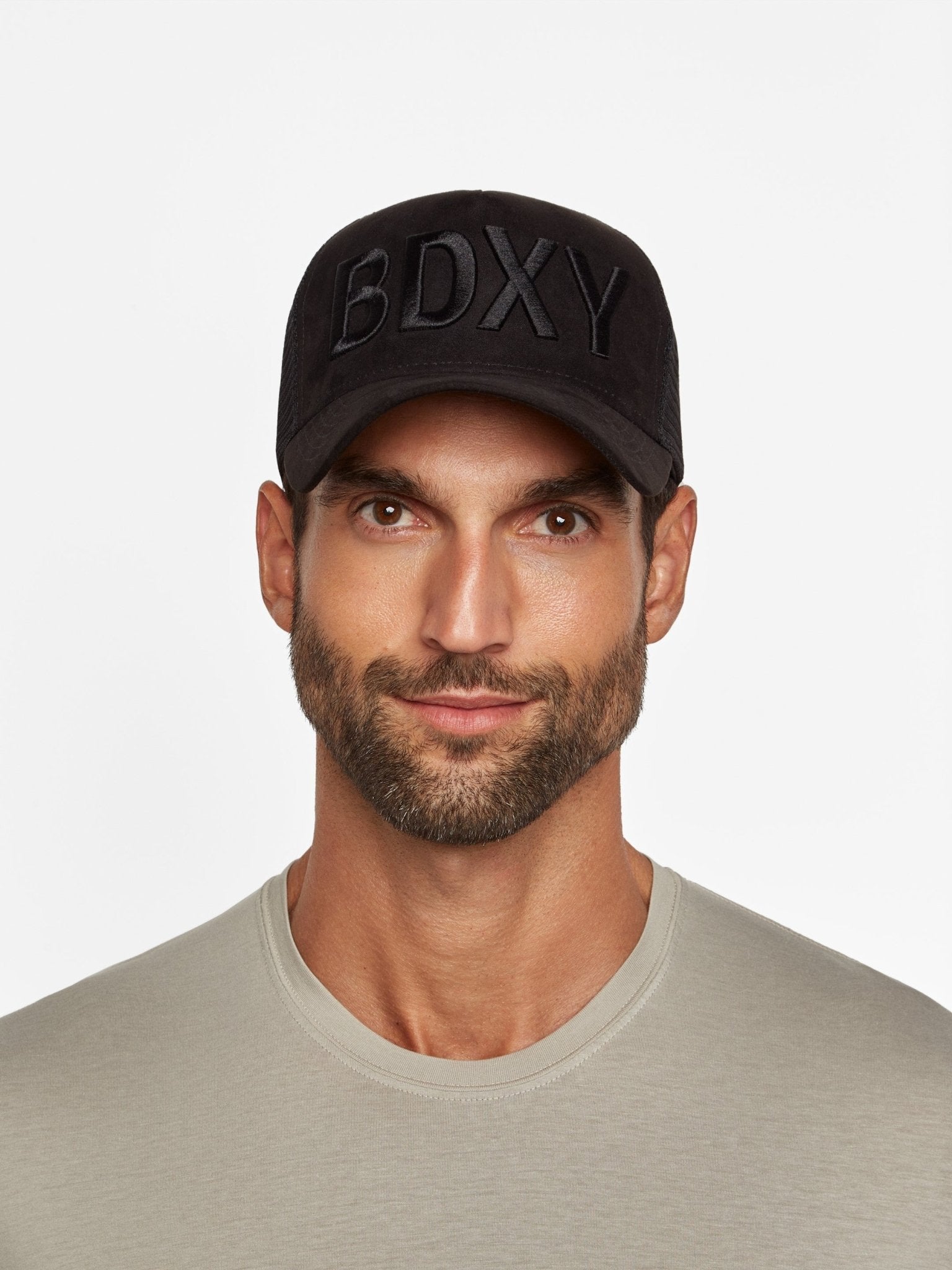 Black "The Gaffer" Trucker Cap by BDXY Studios featuring a mesh back and branded front embroidery.