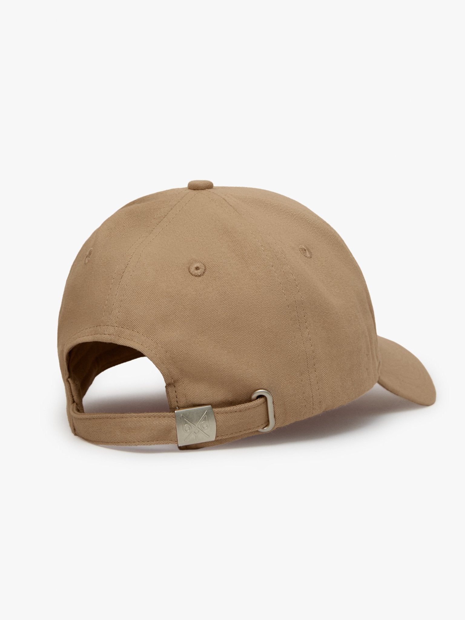 Tan "The Focus" baseball cap by BDXY Studios, featuring a classic cap design with a curved brim and adjustable strap.