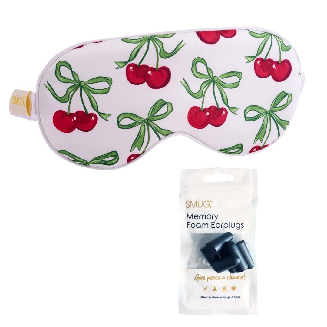 White satin sleep mask with cherry print, soft and comfortable, designed for relaxing sleep by SMUG.