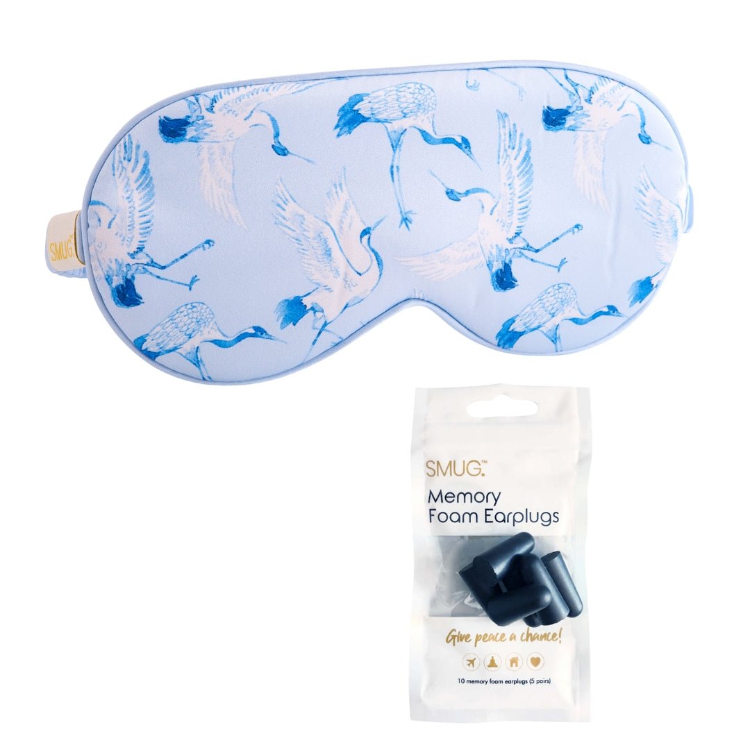 SMUG satin sleep mask with cranes print, featuring smooth satin fabric and an elastic strap for comfortable sleep.