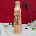 Handcrafted pure copper water bottle with hammered finish, leak-proof design, and Ayurvedic-inspired craftsmanship by SAMA Homes.