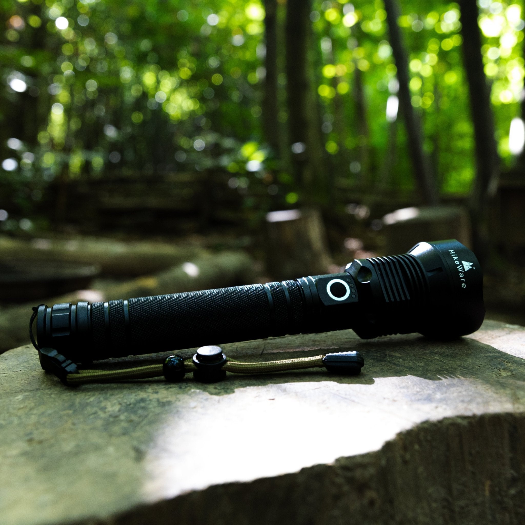 HikeWare LED flashlight with 10,000 lumens, black body, handheld design, bright beam, suitable for outdoor activities and emergencies.