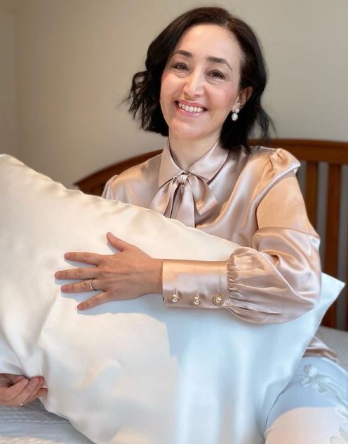 White silk pillowcase from DREAMSILK, standard size, smooth and luxurious fabric for comfortable sleep and elegant bedroom decor.