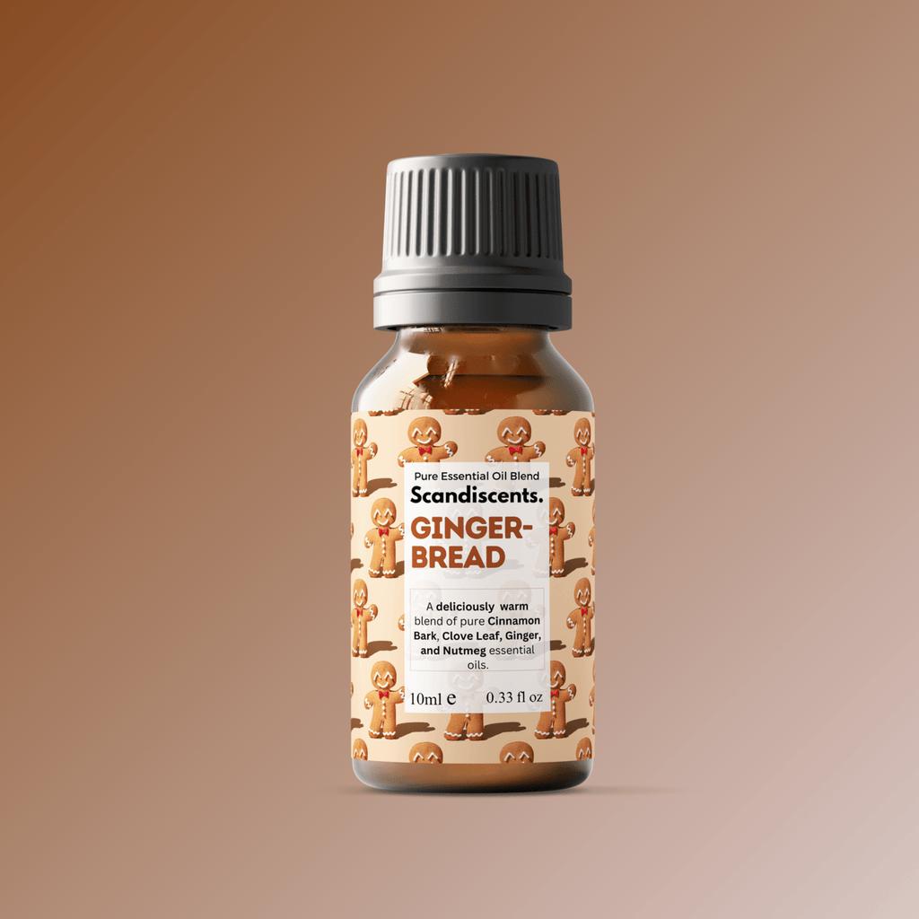 Scandiscents Gingerbread essential oil blend in a small amber glass bottle with a white cap, labeled with product details.