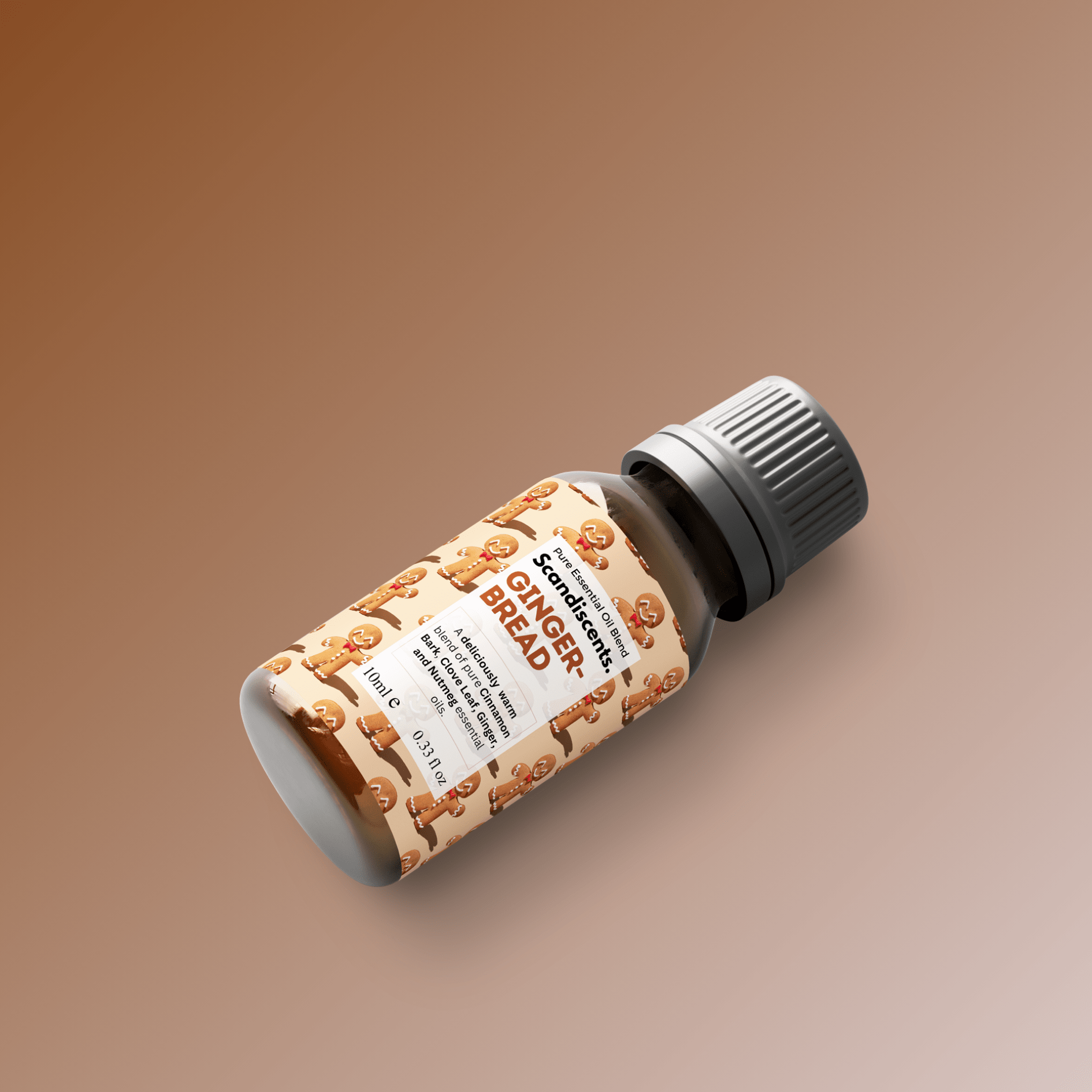 Scandiscents gingerbread essential oil blend in a dark amber glass bottle with a white label and dropper cap.