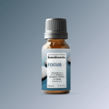 Scandiscents Focus essential oil blend in a glass bottle with dropper, featuring a calming, aromatic composition for concentration.