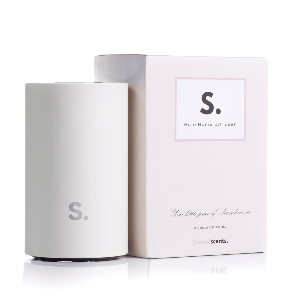Scandiscents Halo Home Diffuser with sleek waterless scented oil design and modern black finish, placed on a wooden surface.