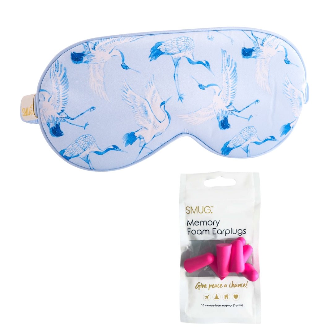 SMUG satin sleep mask with cranes print, featuring a soft, smooth fabric designed for comfortable sleep and relaxation.
