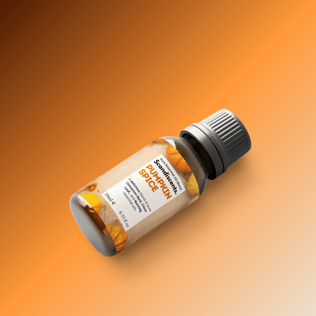 Scandiscents Pumpkin Spice essential oil blend bottle with a label, featuring warm autumnal colors and a natural aroma profile.