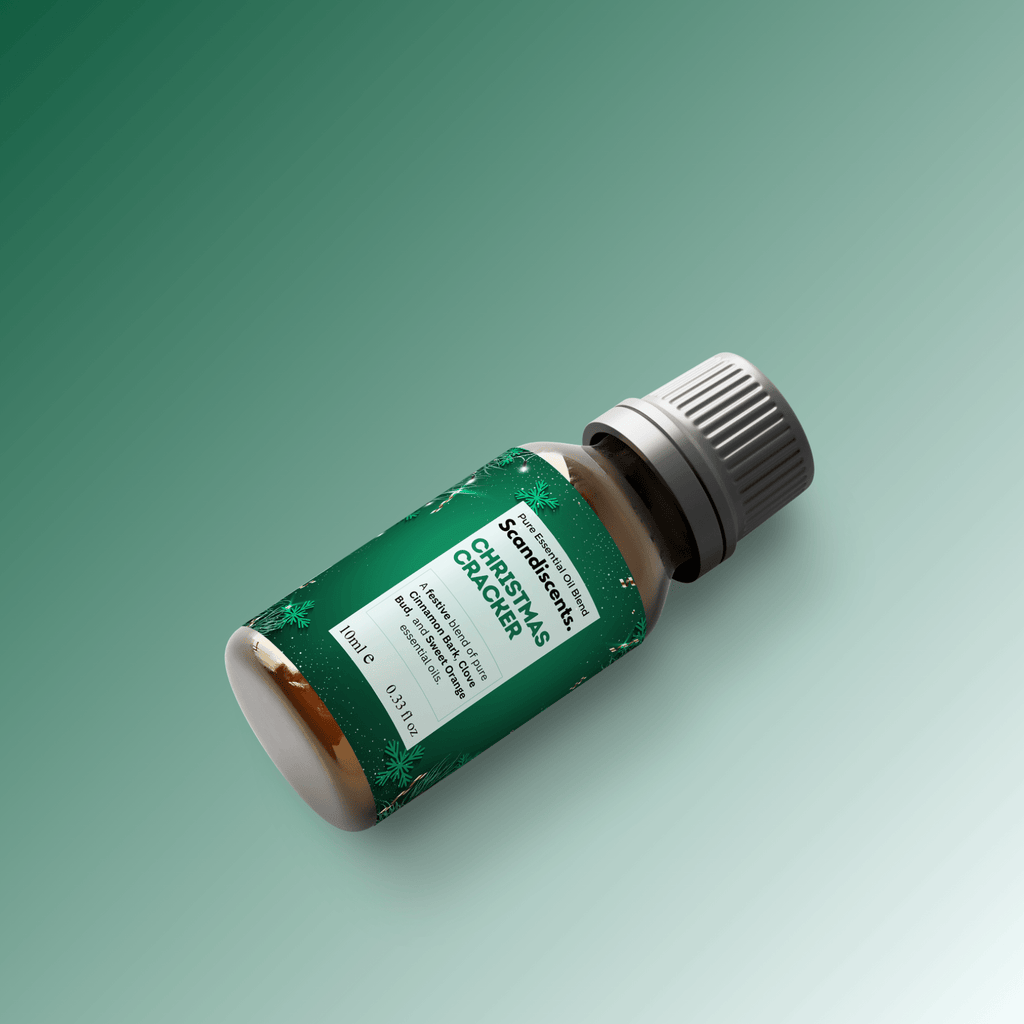 Christmas Cracker essential oil blend from Scandiscents, featuring a festive container with a colorful label and holiday-themed design.