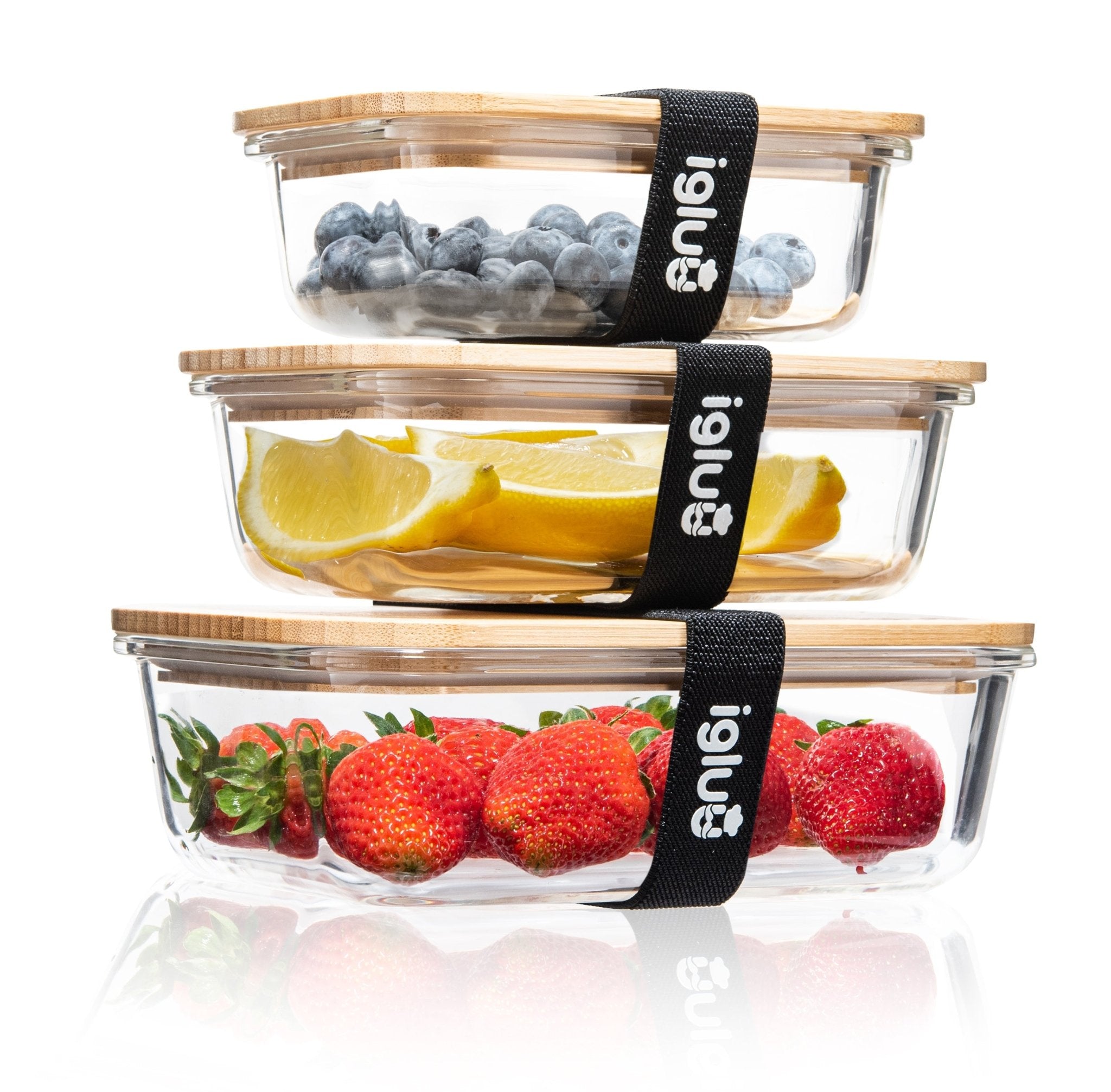 Set of three Igluu Meal Prep glass containers with bamboo lids in assorted sizes, ideal for storing and organizing meals.