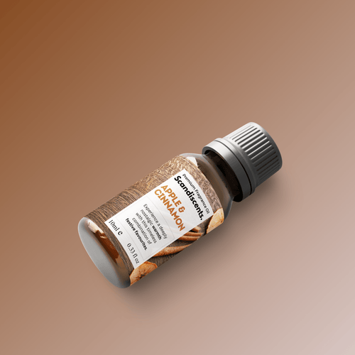 Scandiscents Apple & Cinnamon fragrance oil bottle with a label, showcasing a warm, inviting scent for home aromatherapy.