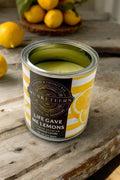 Musketeers Lemon Candle with a bright yellow wax and decorative lemon slice design for fresh citrus scent.