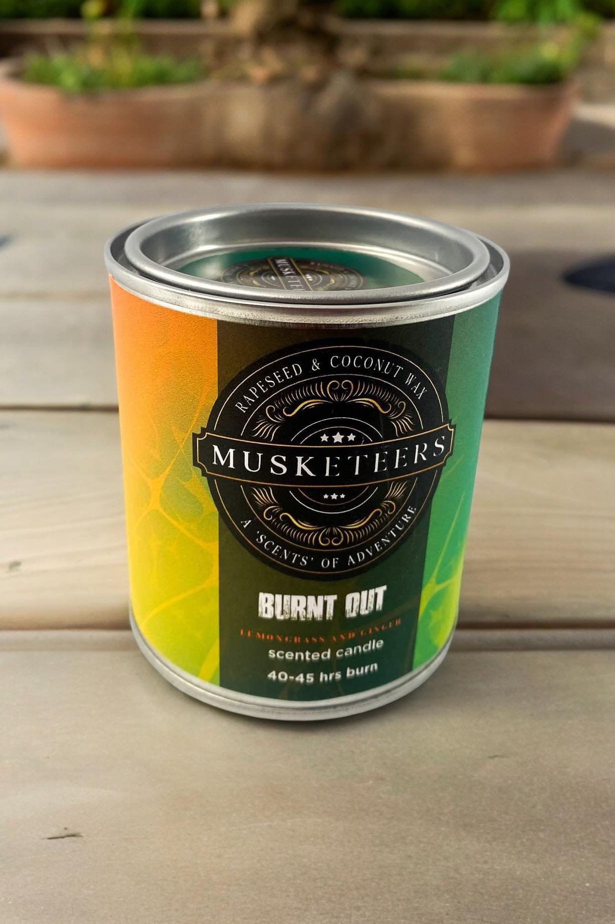 Musketeers Burnt Out Lemongrass and Ginger Candle in a glass jar, fresh spa luxury candle with natural scents.