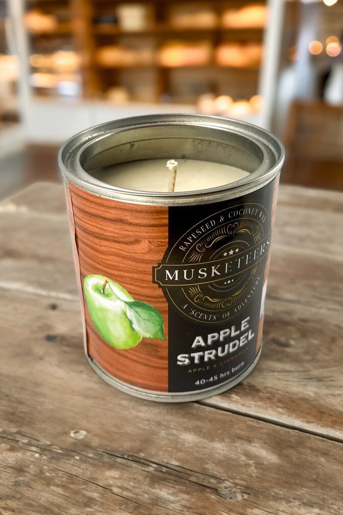 Apple Scented Candle by Musketeers, luxury bakery candle with apple strudel fragrance, in a decorative jar.