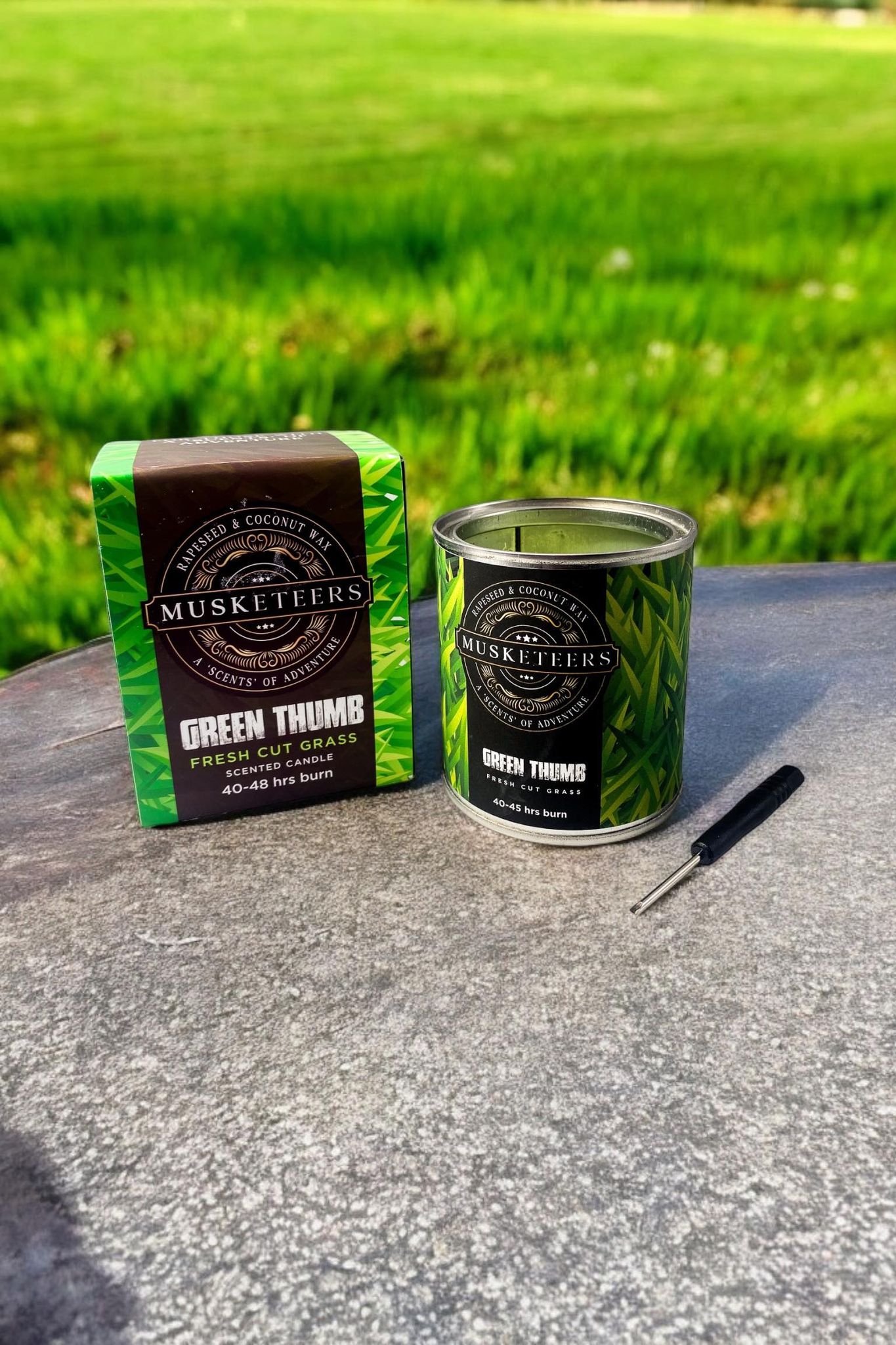 Musketeers Grass Scented Candle UK with fresh, masculine fragrance in a sleek candle holder, ideal for luxury home ambiance.