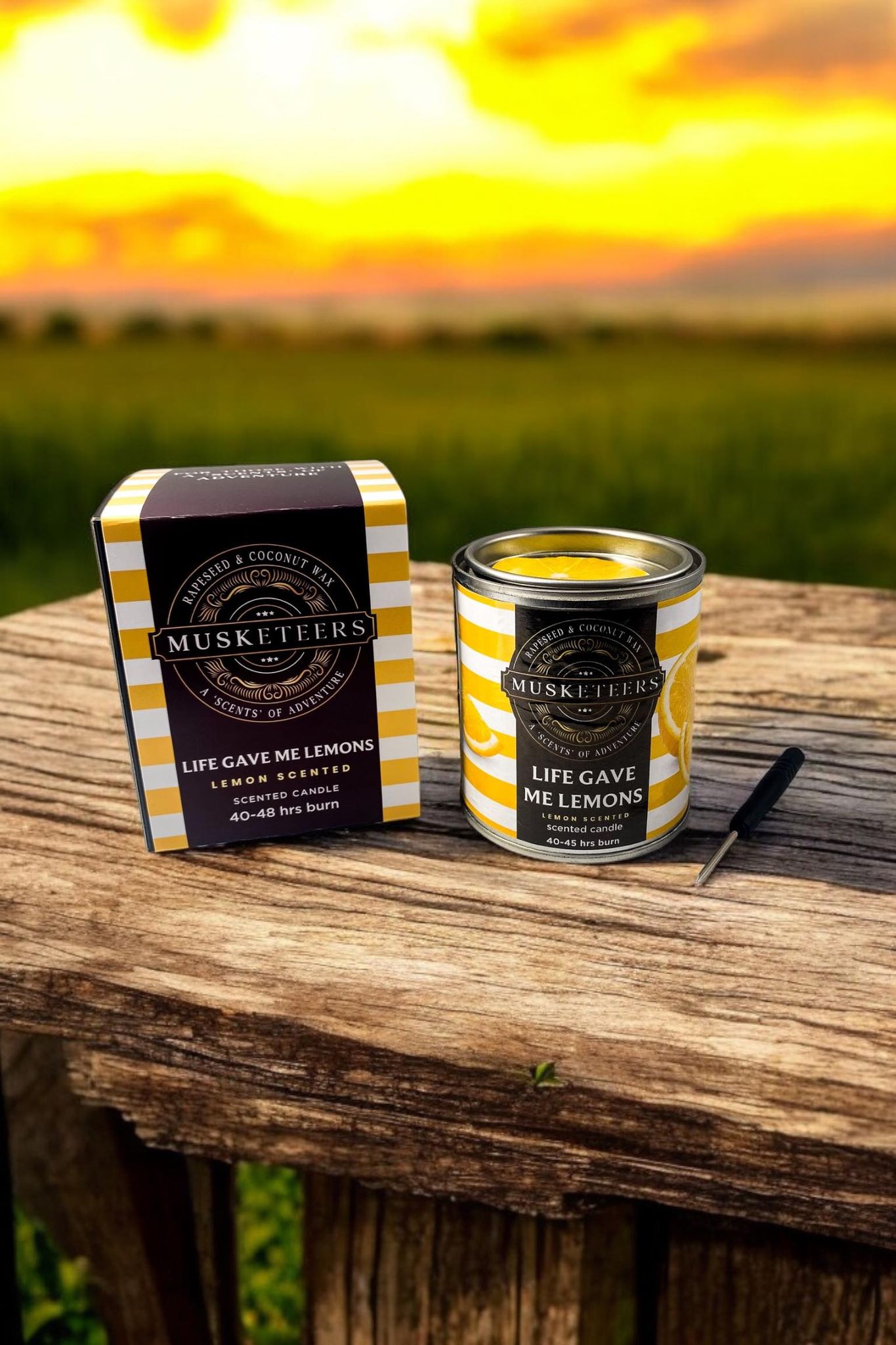 Musketeers Lemon Candle with bright yellow wax and lemon slice design, providing fresh citrus scent for home decor.