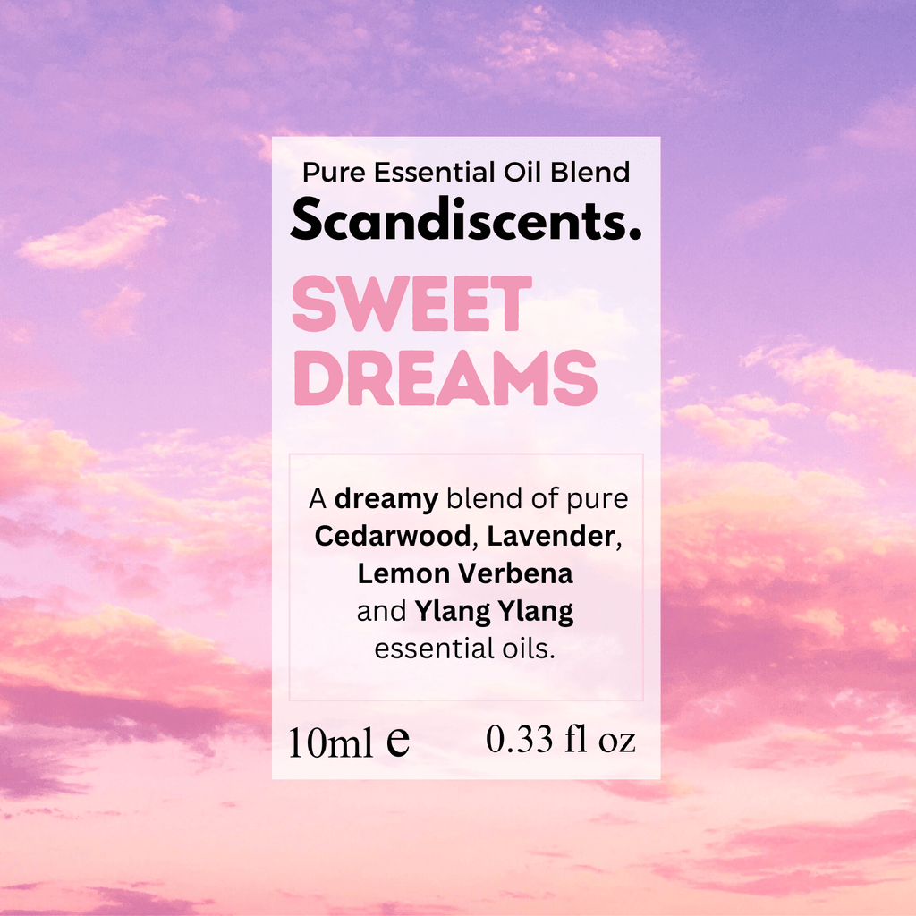 Scandiscents Sweet Dreams essential oil blend in a glass bottle with a dropper, surrounded by lavender and chamomile flowers.
