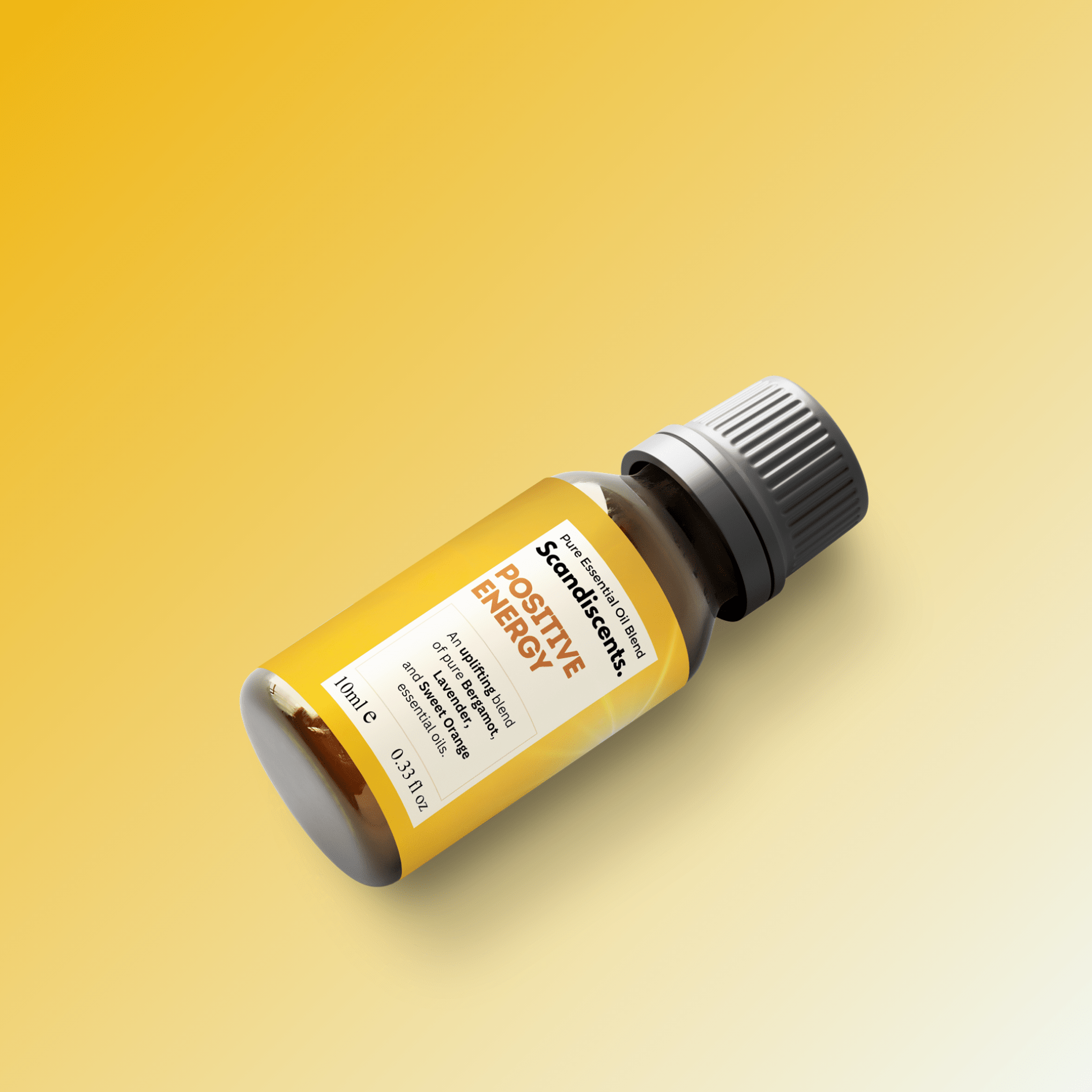 Positive Energy essential oil blend by Scandiscents in a glass bottle with a white label and colorful design, on a neutral background.