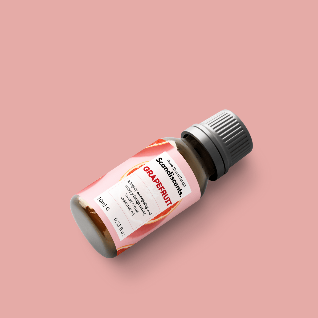 Scandiscents grapefruit essential oil bottle with fresh grapefruit slices and leaves, highlighting natural citrus aroma.
