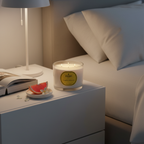 Parks Candles grapefruit and jasmine scented candle in a 350g glass jar with a lit wick, showcasing fresh citrus and floral aromas.