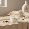 Parks Candles vanilla scented candle in a 70g glass container, with a lit wick and warm glow.
