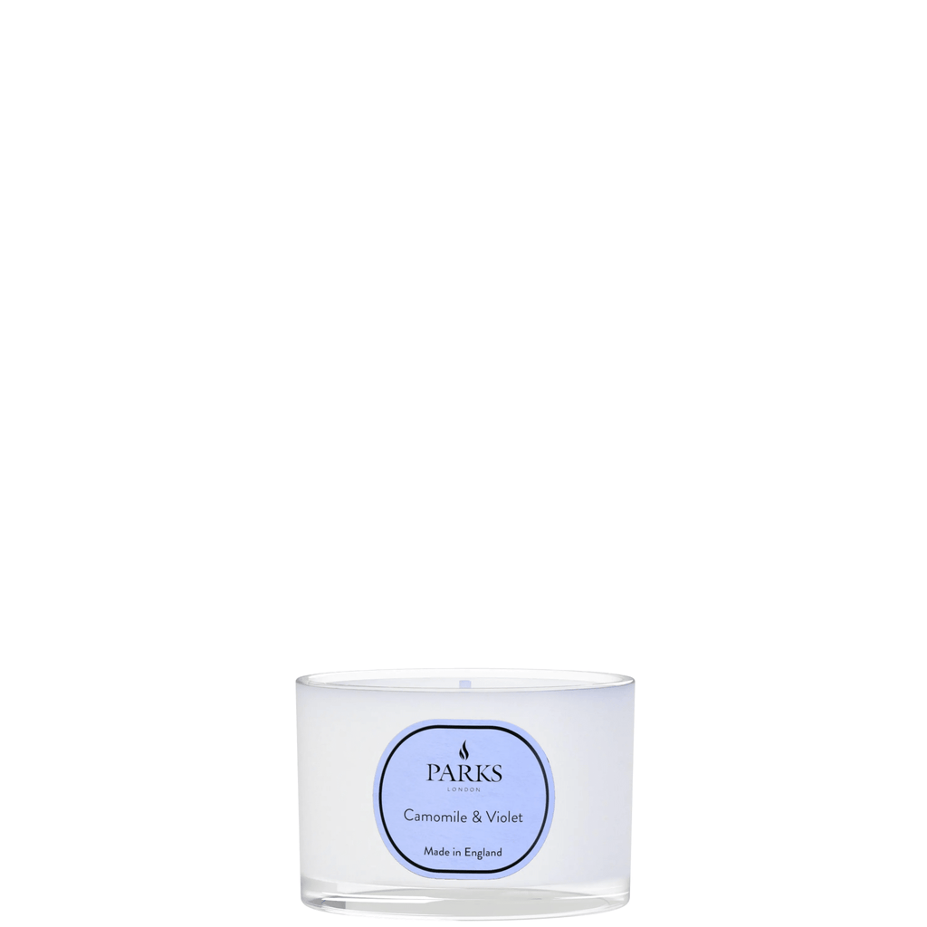 Parks Candles chamomile and violet travel candle in a 70g glass jar, with a soft floral design and wick ready to burn.