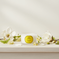 Parks Candles Linden Blossom and Magnolia travel candle in 70g tin, featuring floral scent with blooming flowers and elegant design.