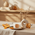 Parks Candles Peach & Amaryllis travel candle in a 70g container with a peach and floral design on the label.