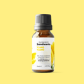 A bottle of Scandiscents Ylang Ylang essential oil with a dropper cap, set against a neutral background.