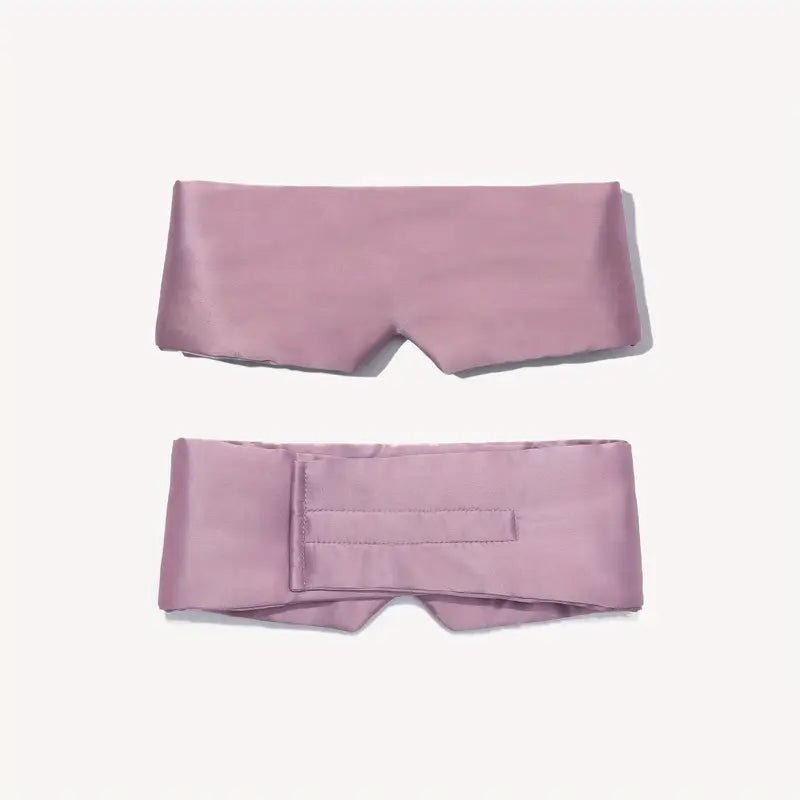 DREAMSILK blackout silk sleep mask covering eyes with smooth, luxurious black silk for restful sleep and eye comfort.