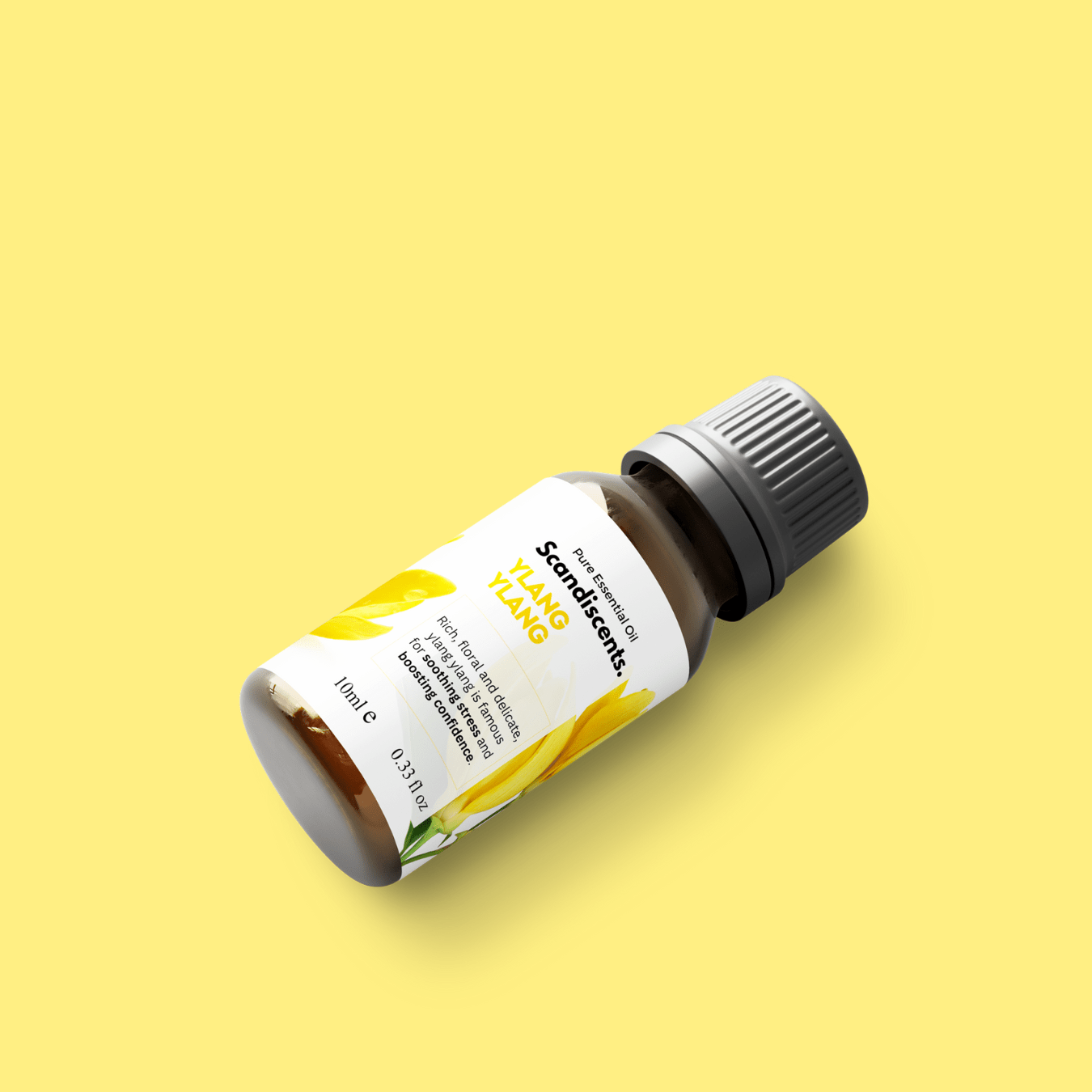 Scandiscents Ylang Ylang essential oil bottle with dropper on a white background, showcasing the product packaging and branding.