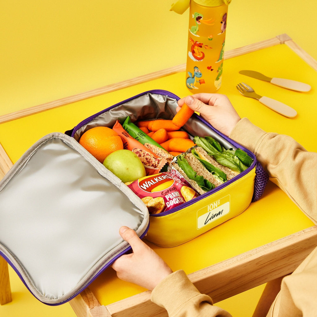 Kids insulated lunch bag by ION8 featuring colorful dragon design, medium size, and padded handle for easy carrying.