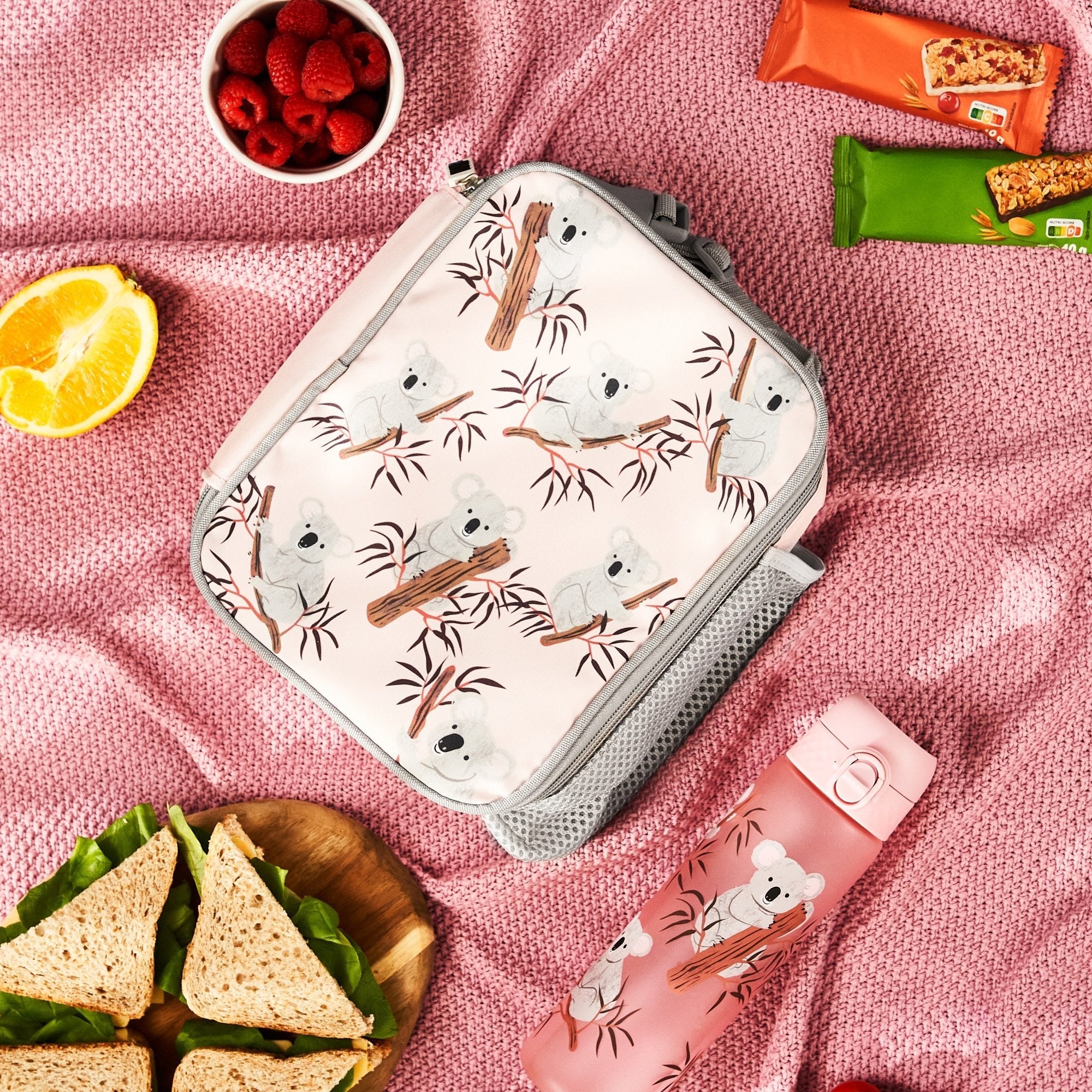 Insulated kids lunch bag featuring a cute koala design, medium size, by ION8, perfect for school or outings.