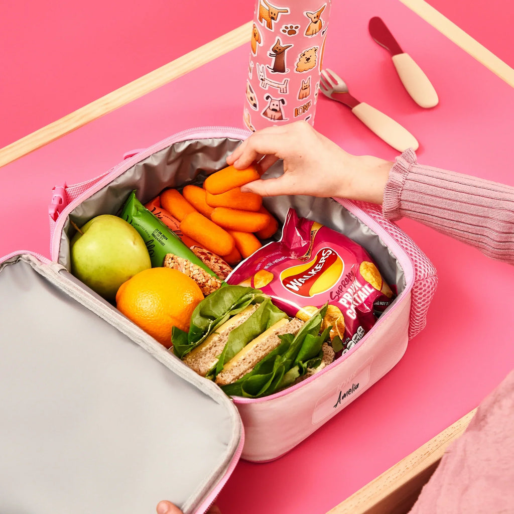 Medium ION8 insulated kids lunch bag with dog design, featuring a secure zipper and padded handle for easy carrying.