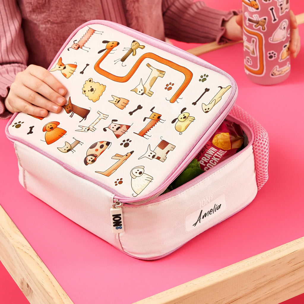 Kids insulated lunch bag featuring colorful dog print by ION8, medium size, with a zipper closure and carry handle.